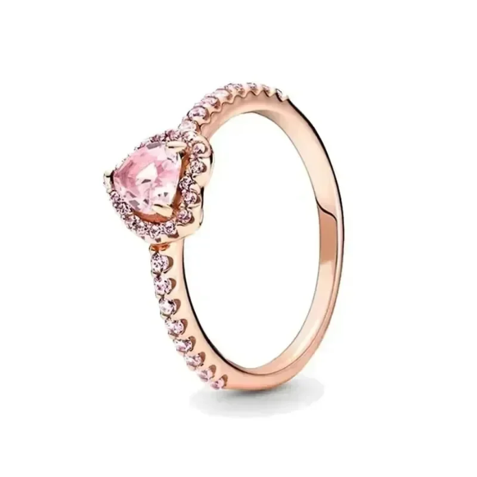 Rose gold ring with a pink gemstone on a white background