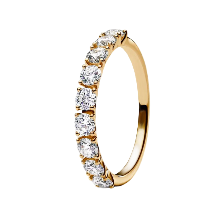 Gold ring with clear gemstones on a white background