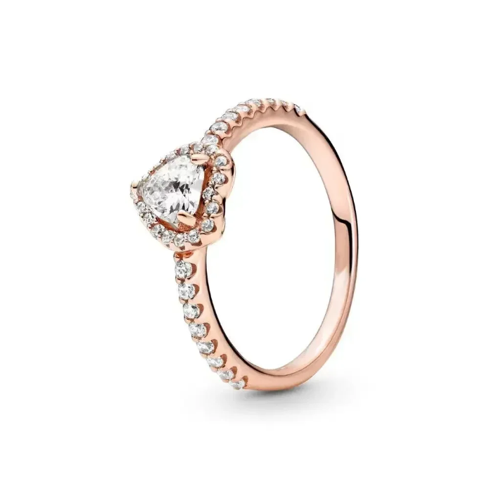 Rose gold ring with a heart-shaped diamond on a white background