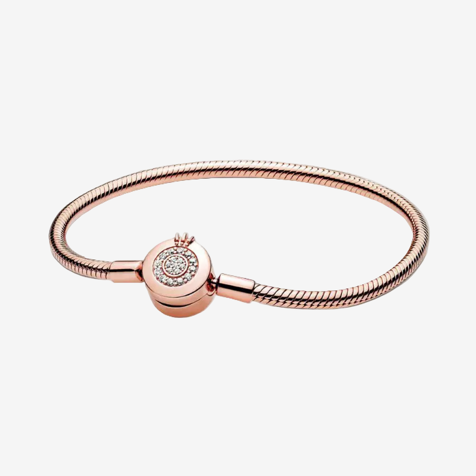 Rose gold bracelet with a clasp on a white background