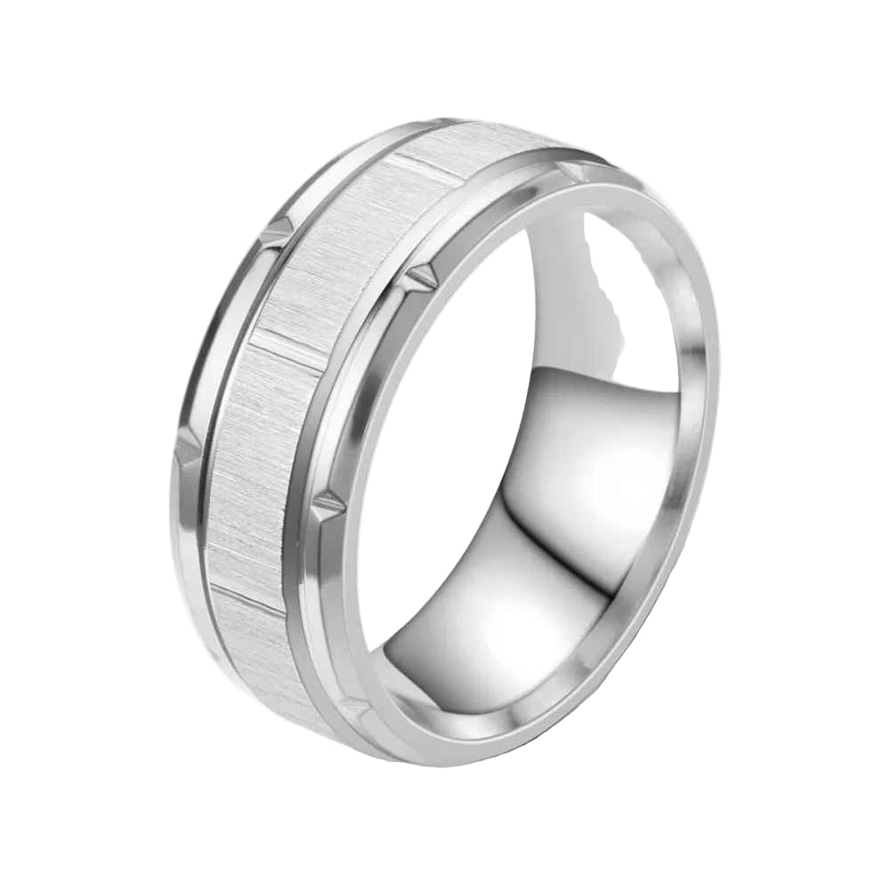 Silver ring with a textured band on a white background