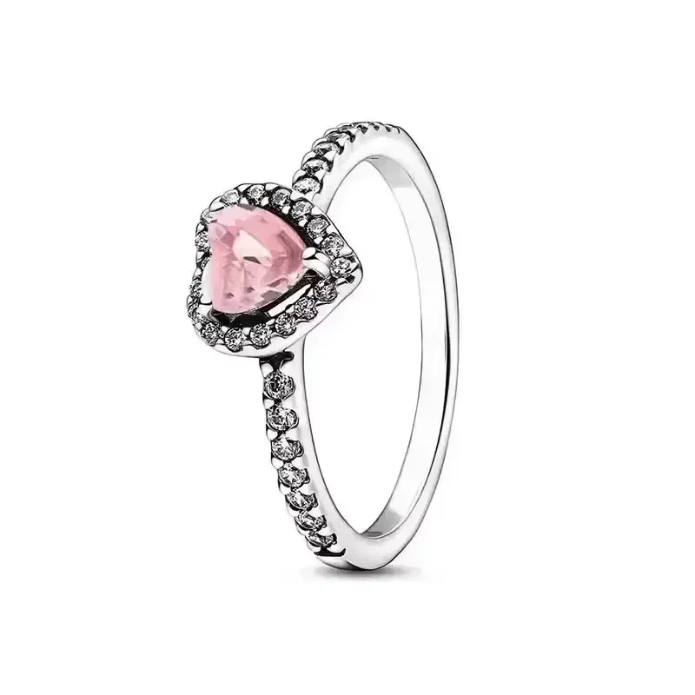 Silver ring with a pink heart-shaped gemstone on a white background
