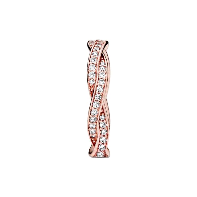 Rose gold earring with diamond accents on a white background