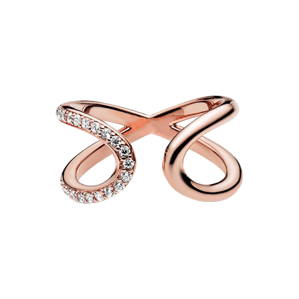 Rose gold ring with diamond accents on a white background