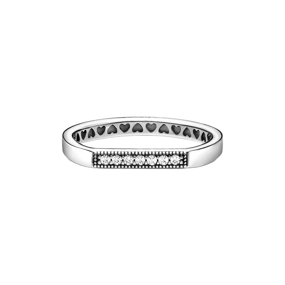 Silver ring with heart and diamond designs on a white background