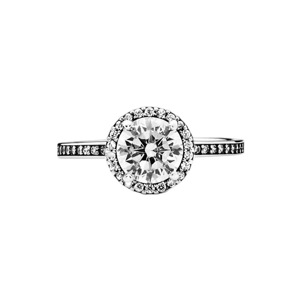 Diamond ring with a halo on a white background