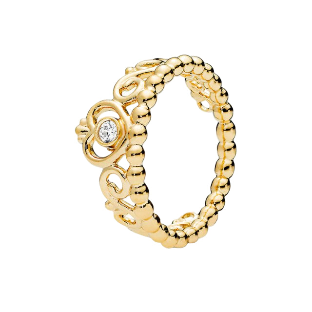 Gold ring with intricate design and diamond on a white background