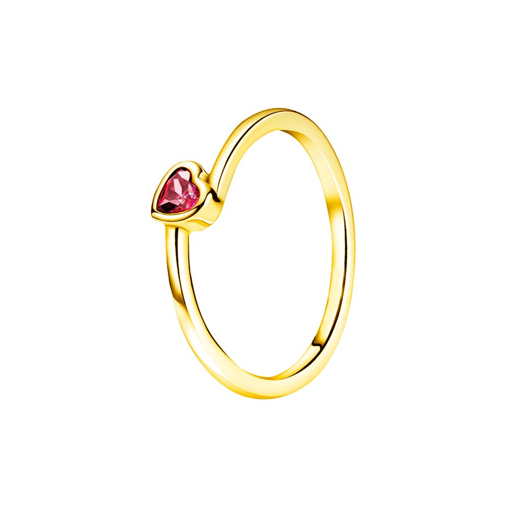 gold ring with a small pink heart stone